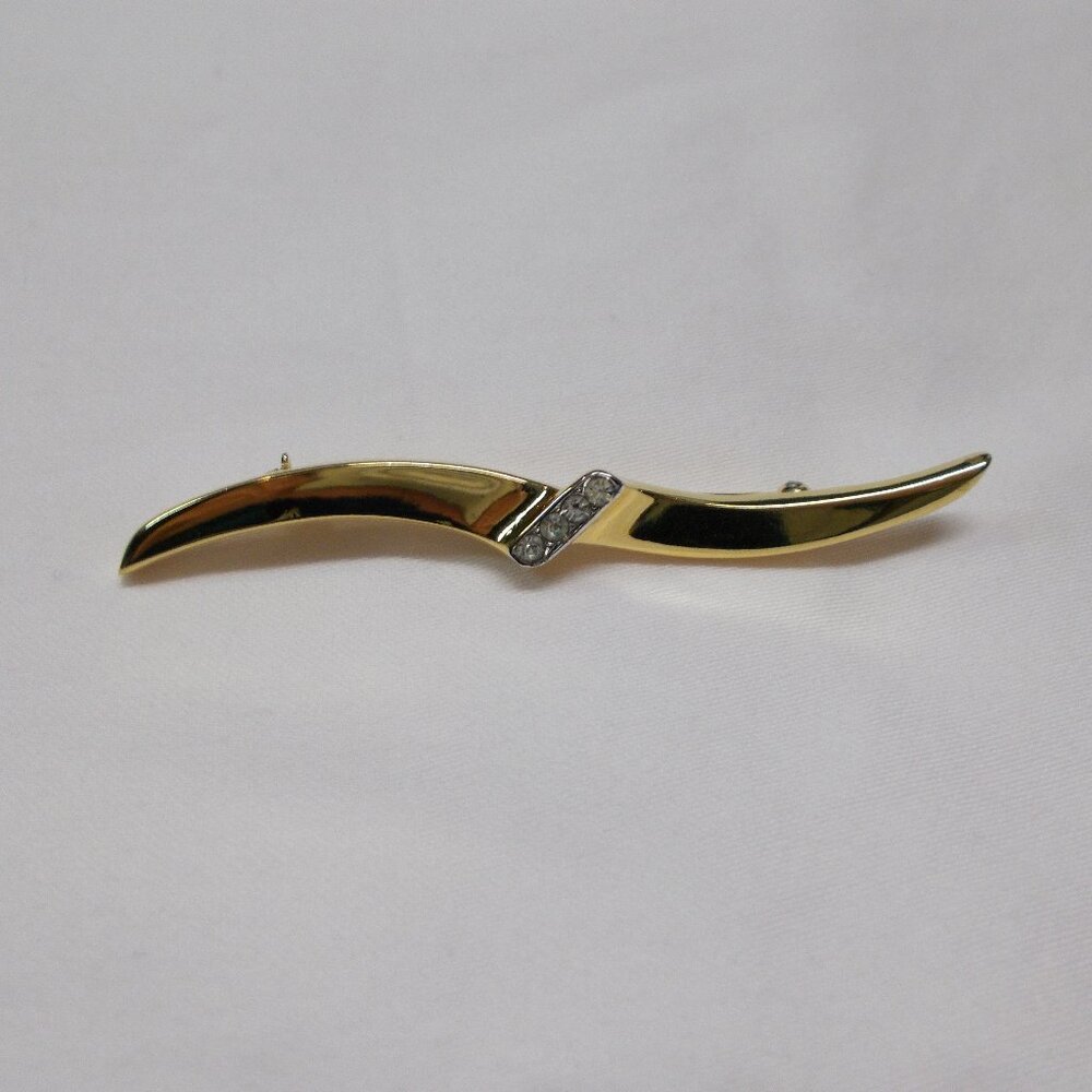 Vintage Trifari gold-tone wave pin with four faux diamonds